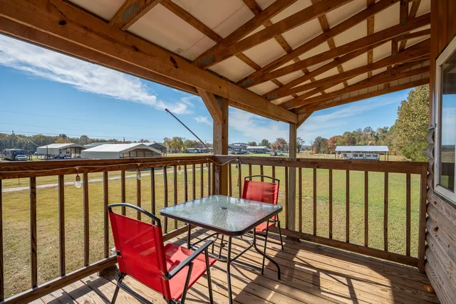a view of a balcony with furniture