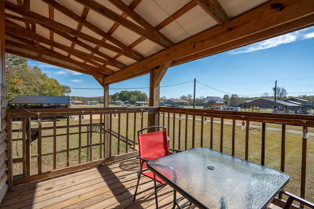 a view of a balcony with wooden floor