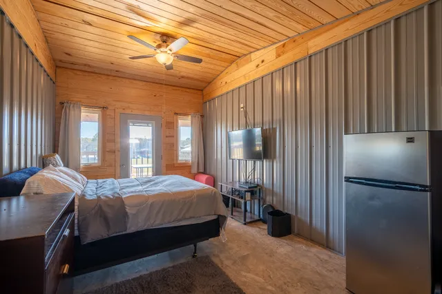 a bedroom with a bed and a window