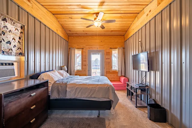 a bed room with a bed and a window