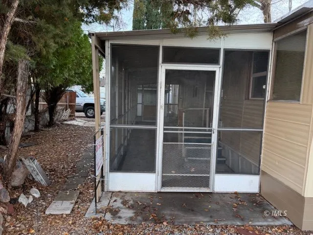 a view of a house with a door and a window