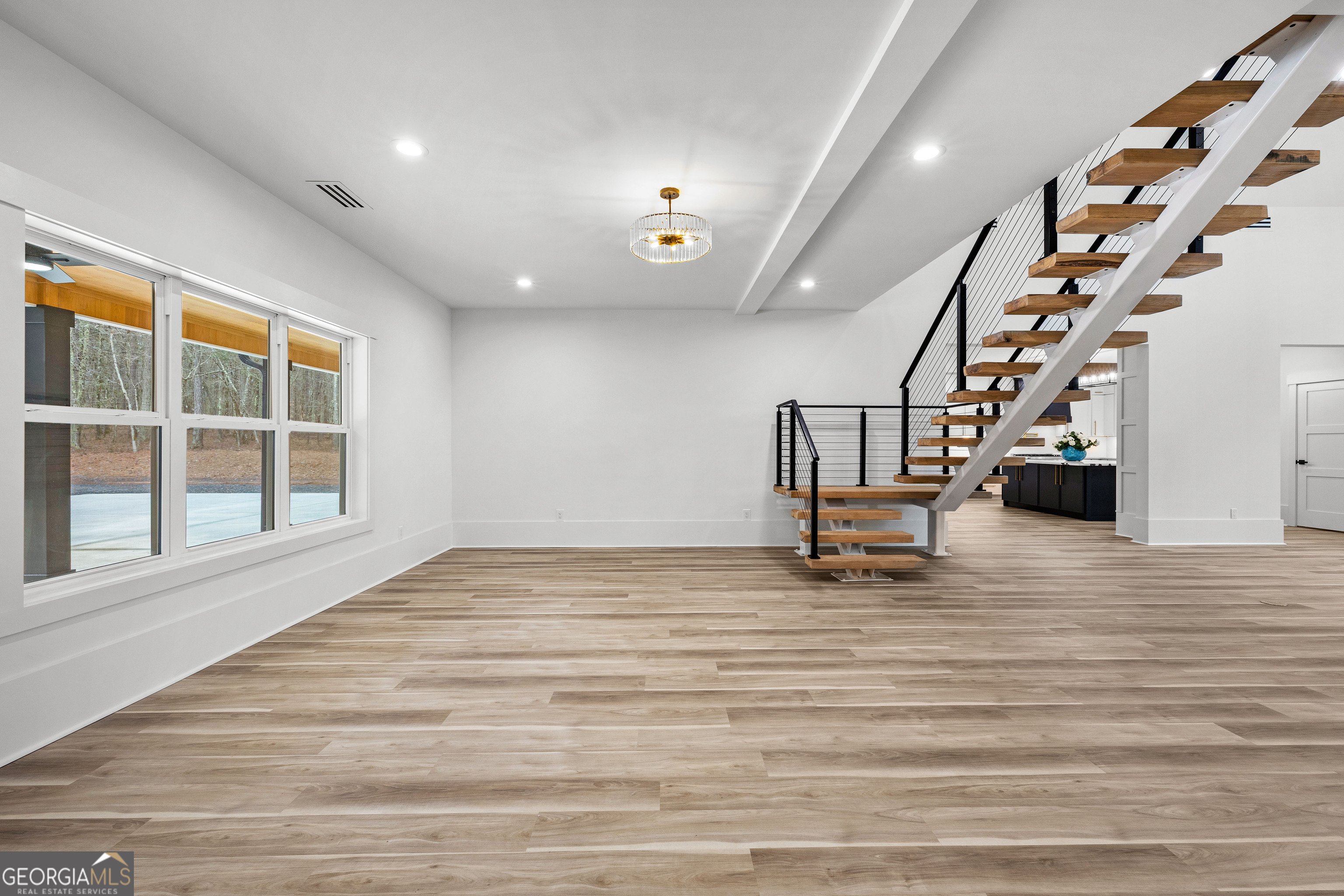 354 Turner Road Newnan, GA 30263 - Photo 12 of 83 a view of an empty room with stairs
