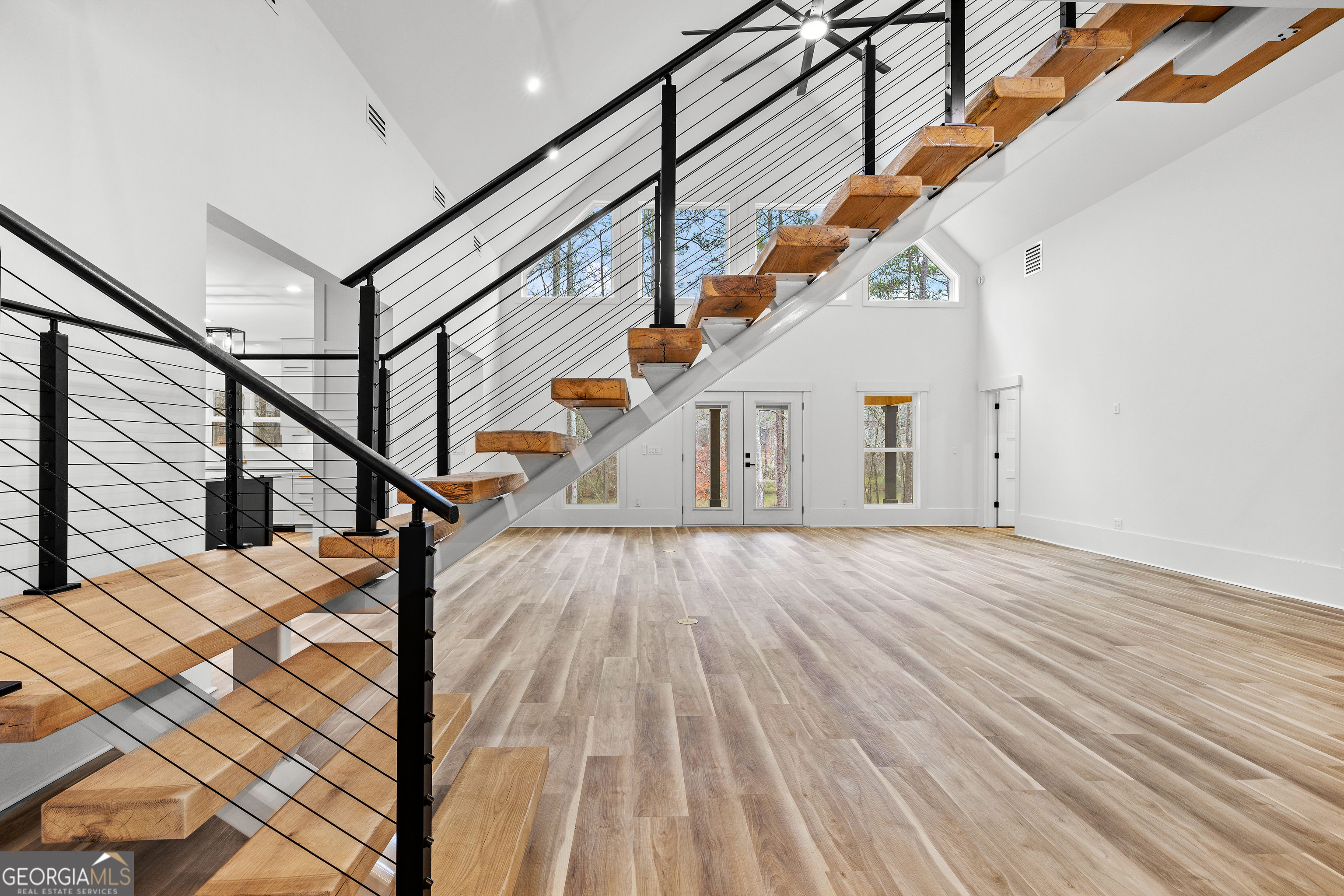 354 Turner Road Newnan, GA 30263 - Photo 14 of 83 a view of entryway and hall with wooden floor