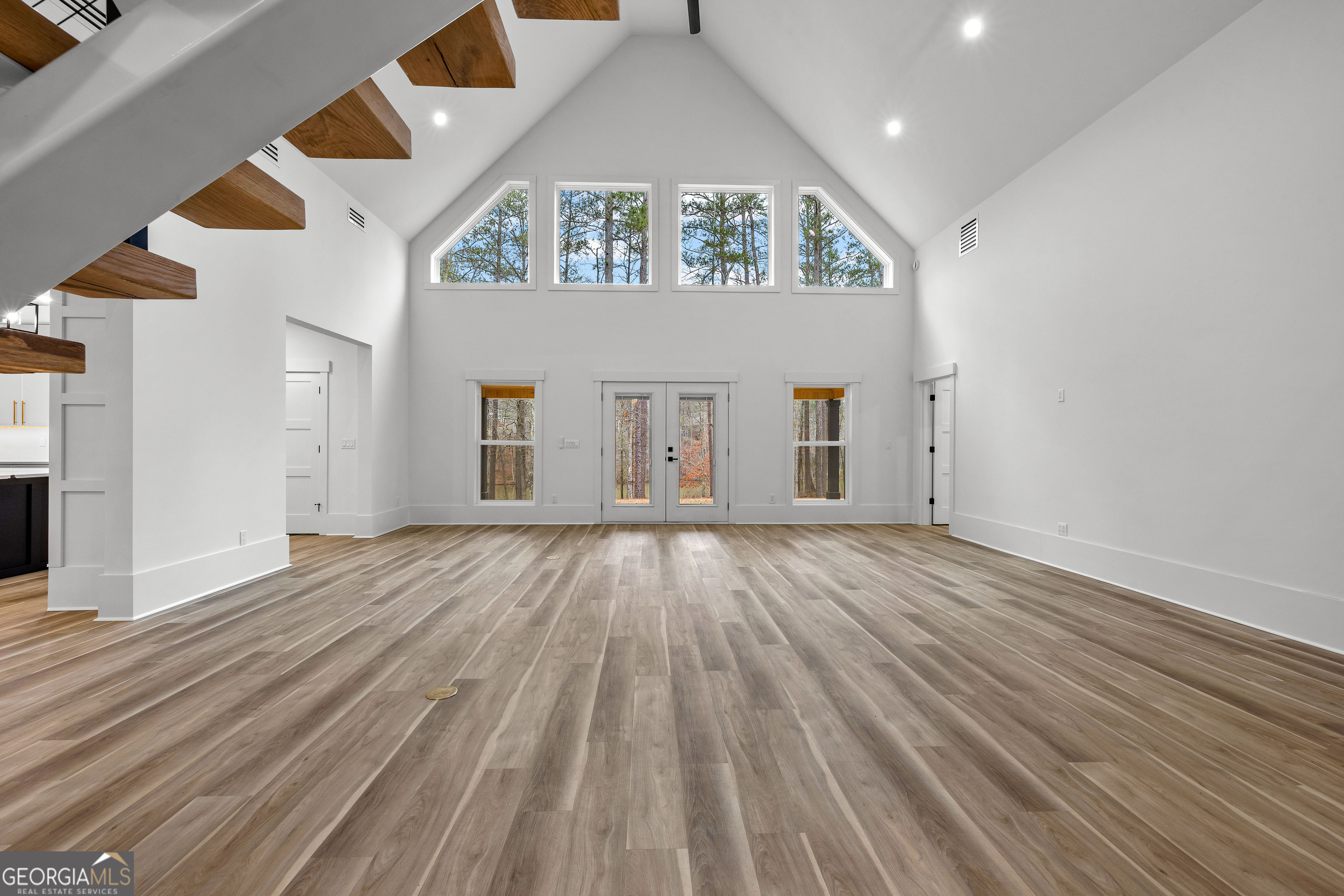 354 Turner Road Newnan, GA 30263 - Photo 15 of 83 an empty room with wooden floor and windows