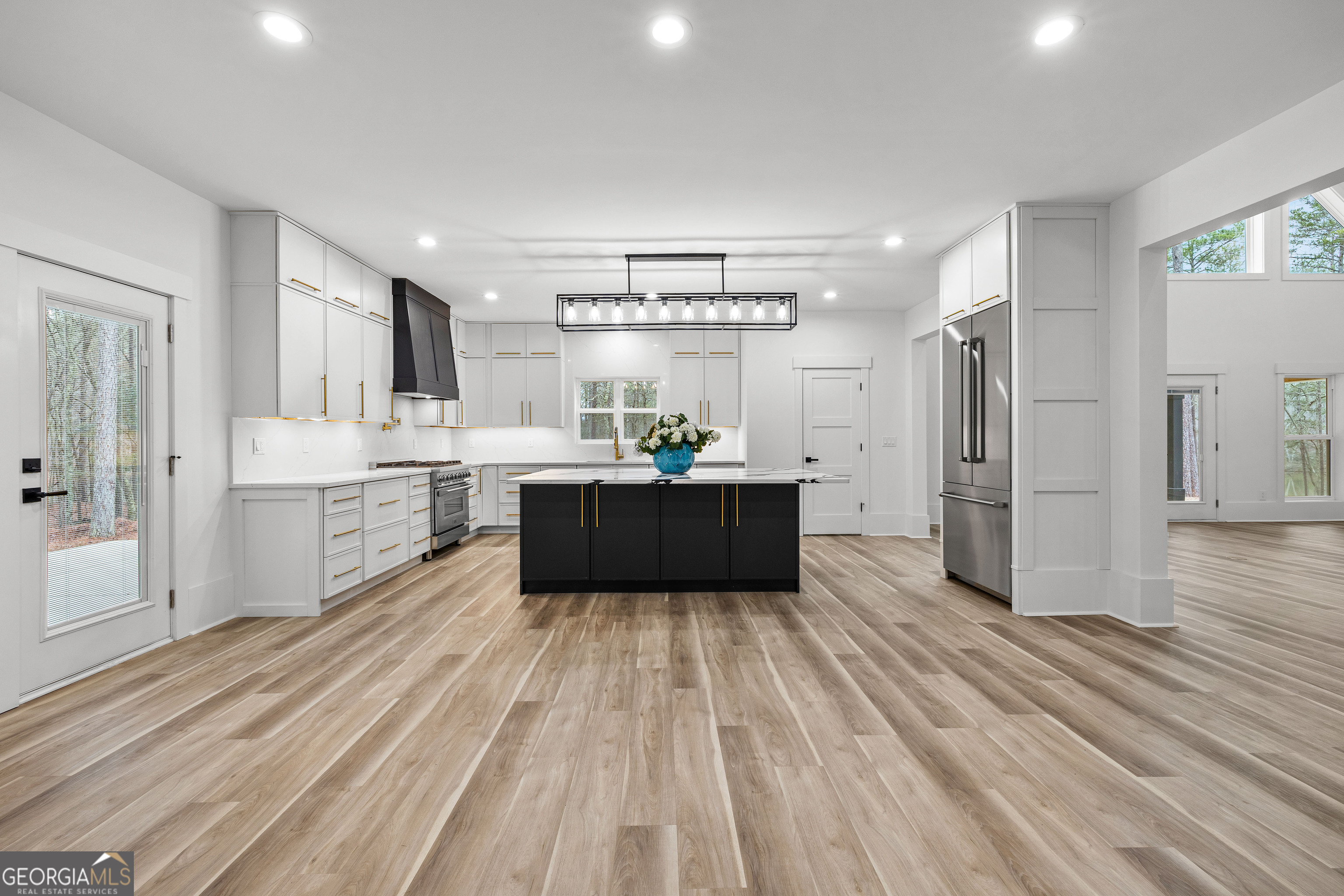 354 Turner Road Newnan, GA 30263 - Photo 16 of 83 a large kitchen with a lot of counter space and wooden floor