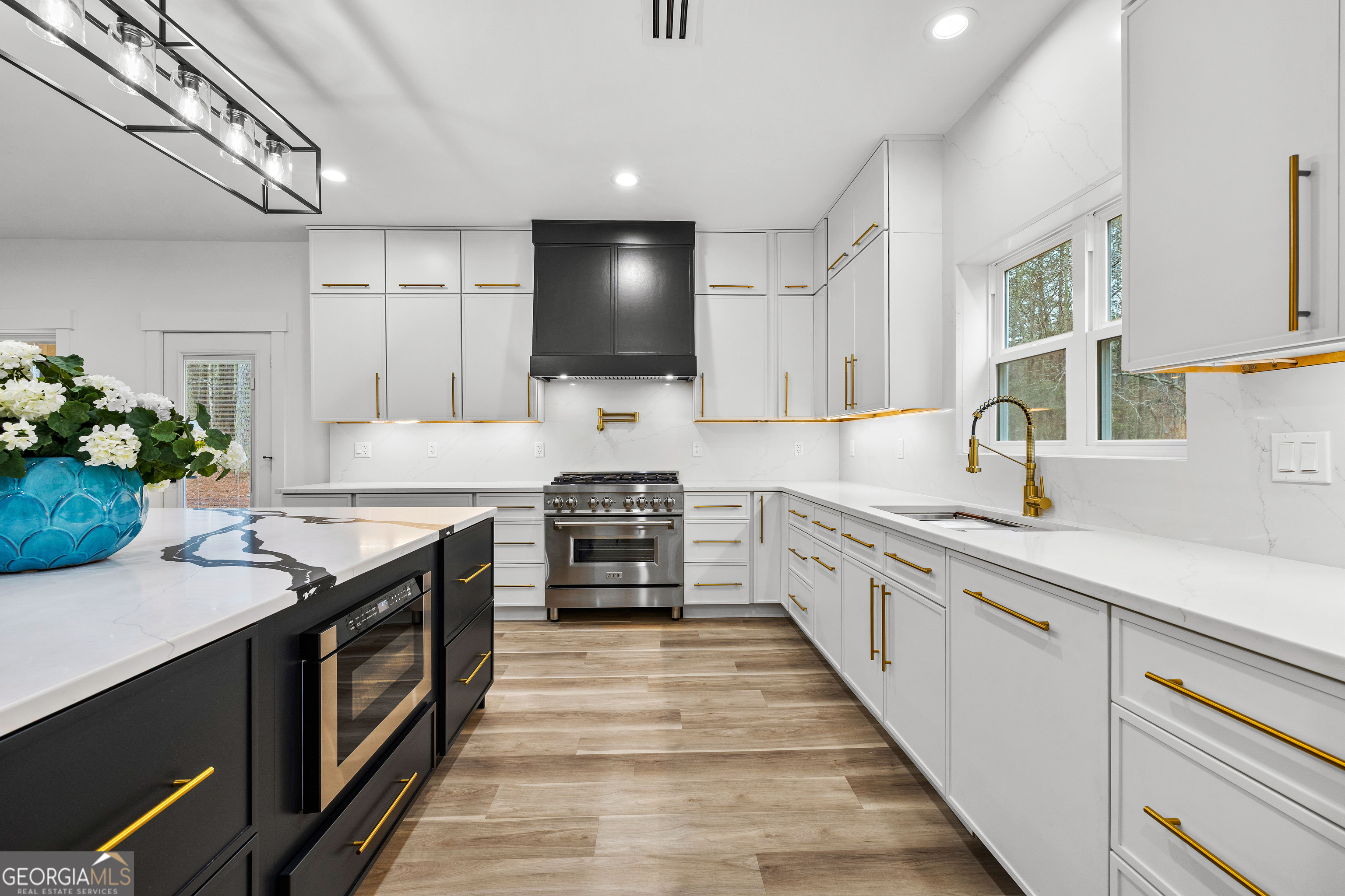 354 Turner Road Newnan, GA 30263 - Photo 25 of 83 a kitchen with stainless steel appliances granite countertop a stove and a sink