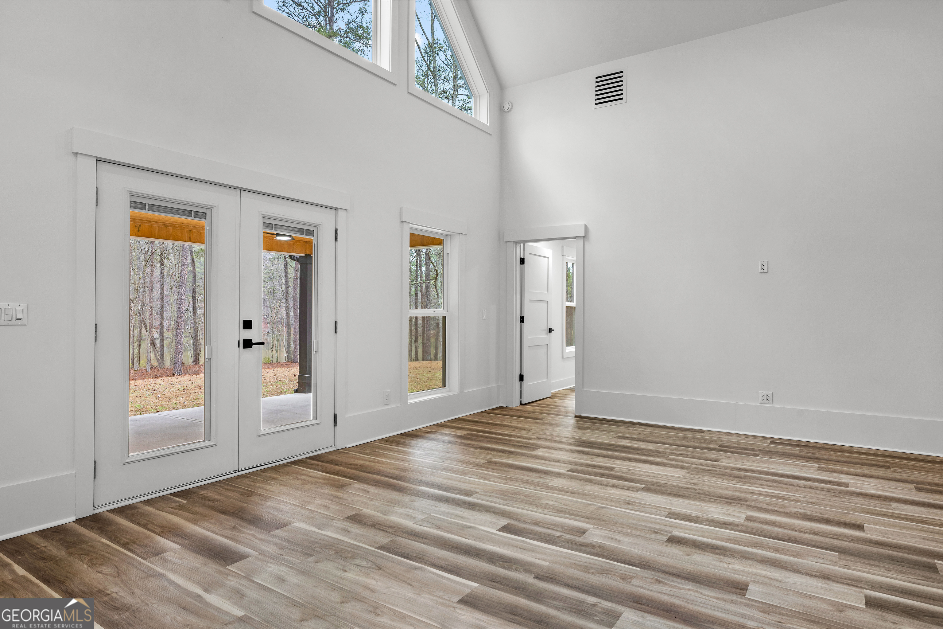 354 Turner Road Newnan, GA 30263 - Photo 30 of 83 a view of empty room with wooden floor and fan