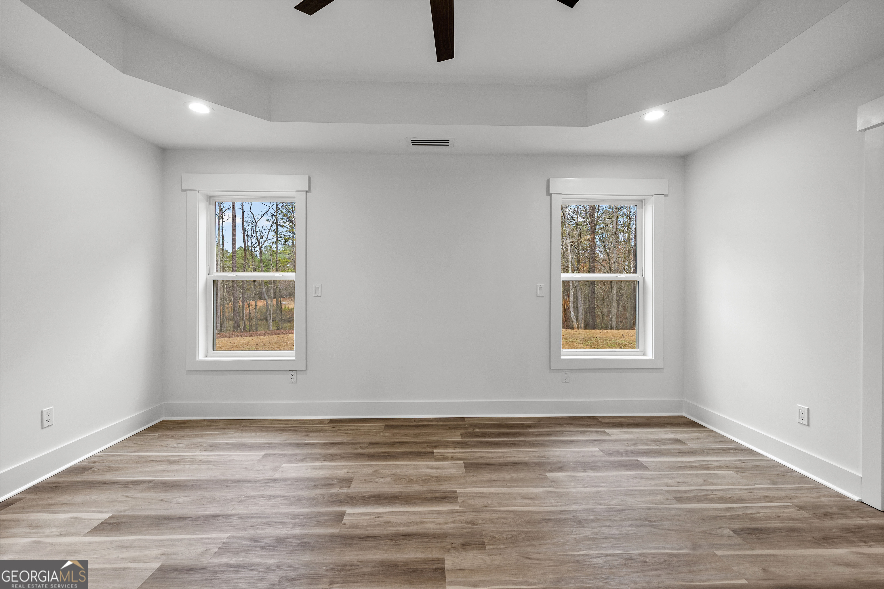 354 Turner Road Newnan, GA 30263 - Photo 32 of 83 a view of an empty room with a window and wooden floor