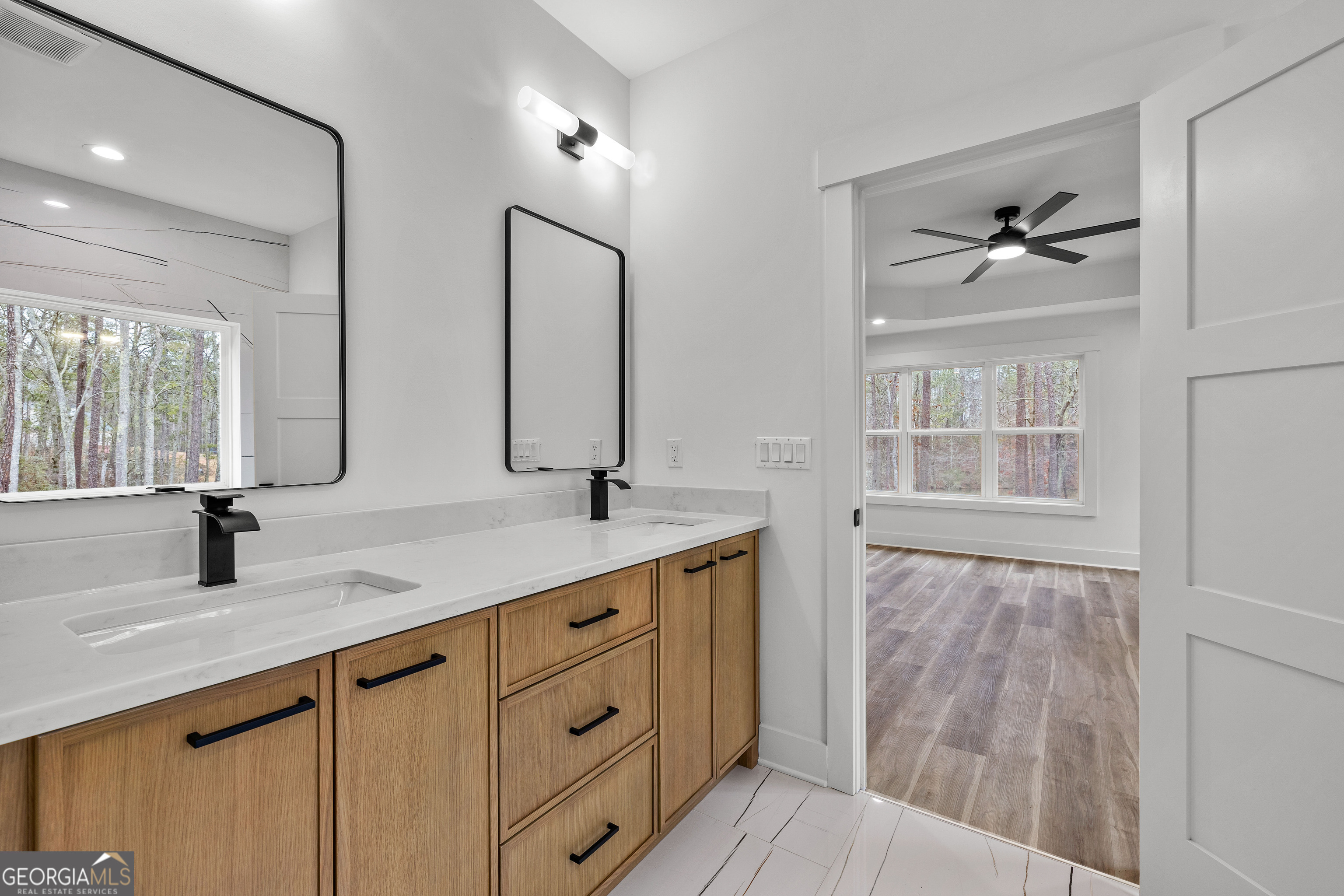 354 Turner Road Newnan, GA 30263 - Photo 38 of 83 a bathroom with a double vanity sink and a mirror