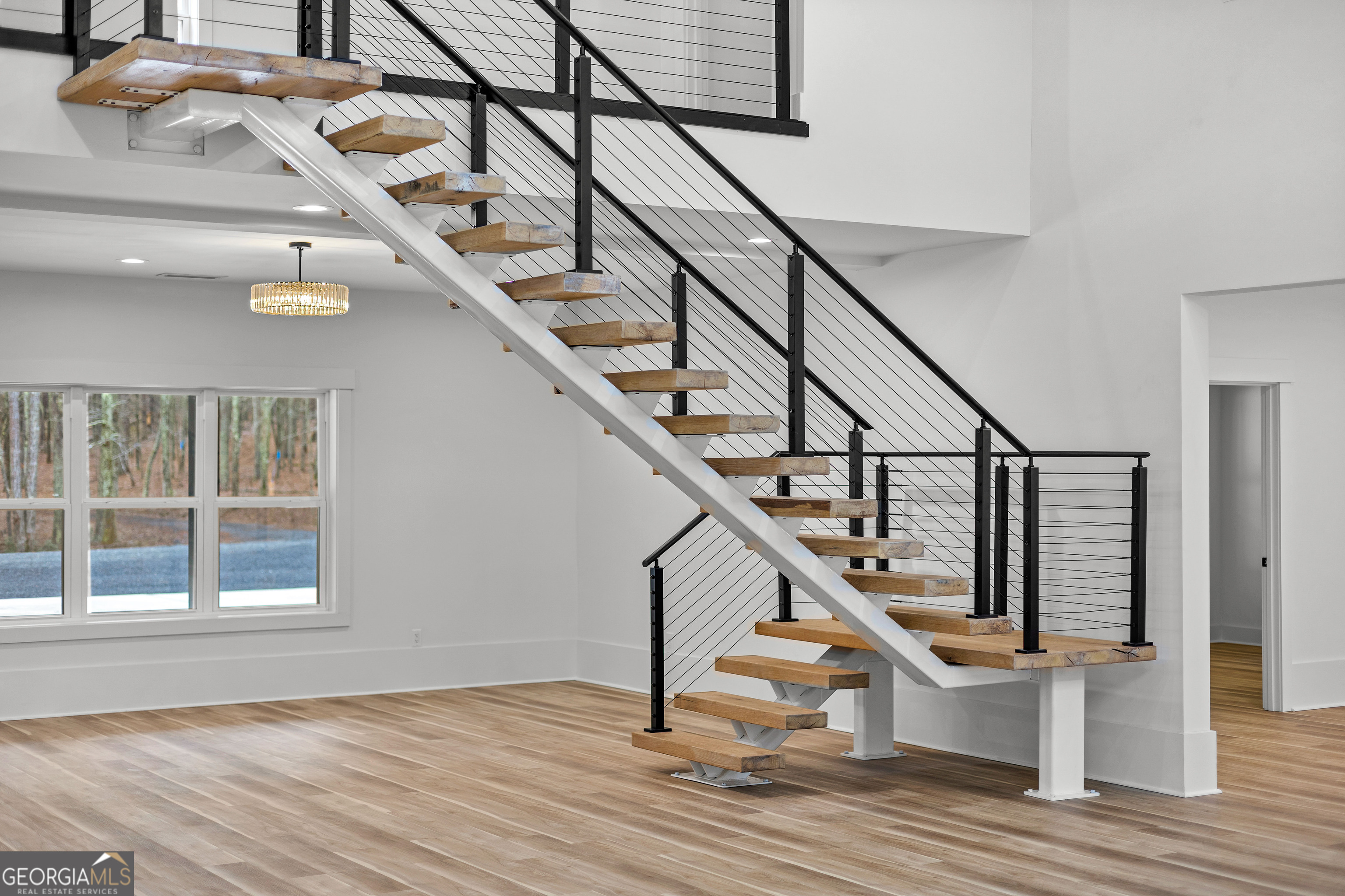 354 Turner Road Newnan, GA 30263 - Photo 44 of 83 a view of entryway and hall with wooden floor