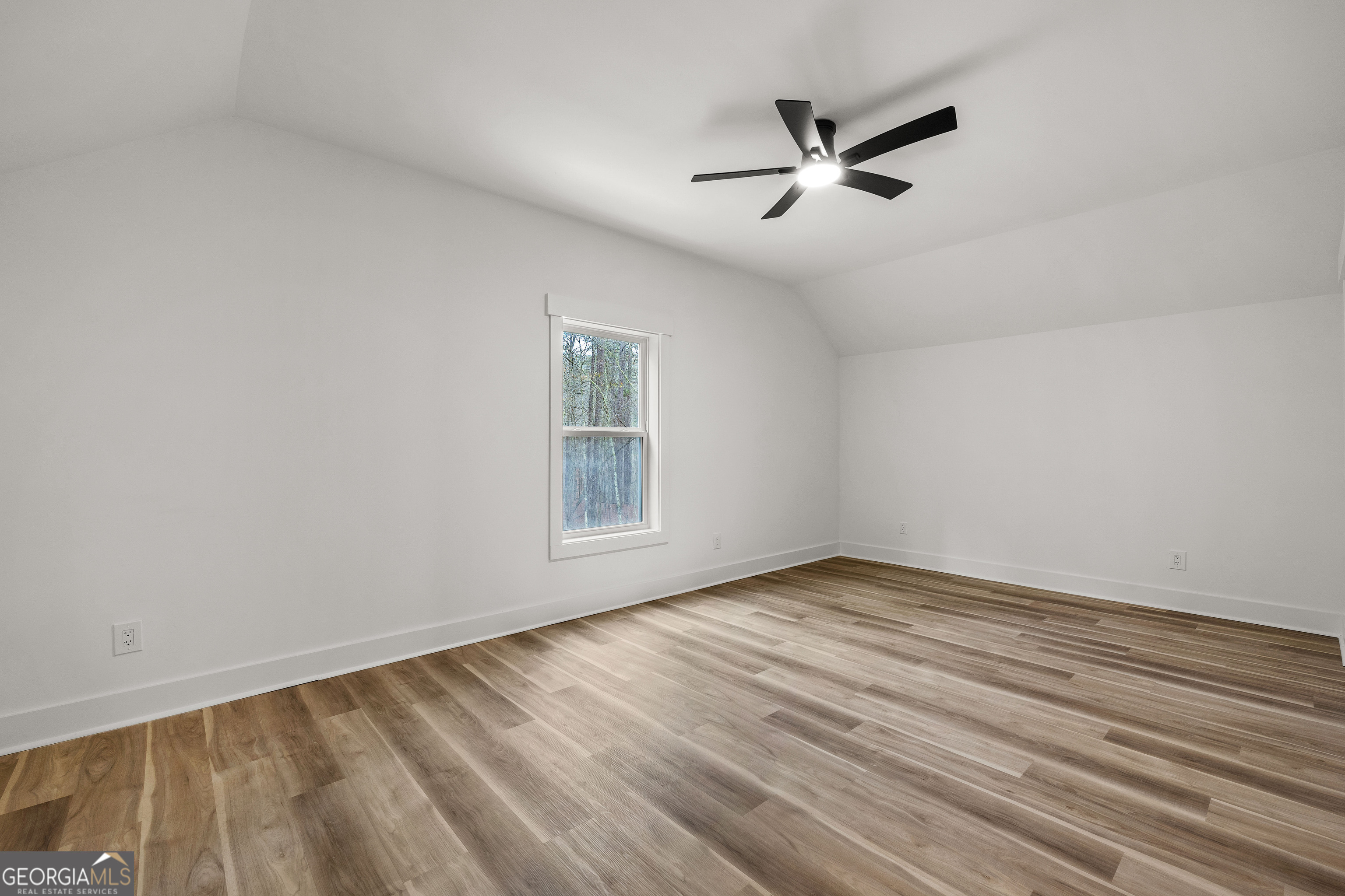354 Turner Road Newnan, GA 30263 - Photo 49 of 83 wooden floor in an empty room with a window