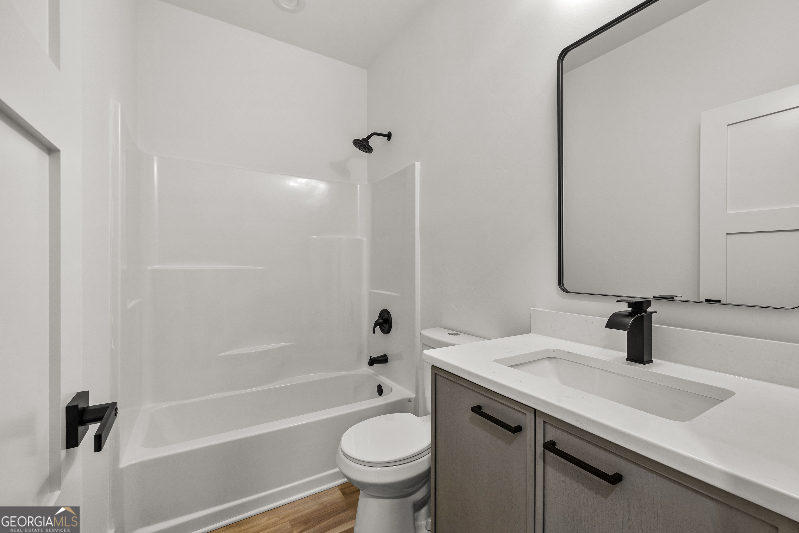 354 Turner Road Newnan, GA 30263 - Photo 54 of 83 a bathroom with a sink a toilet and a mirror