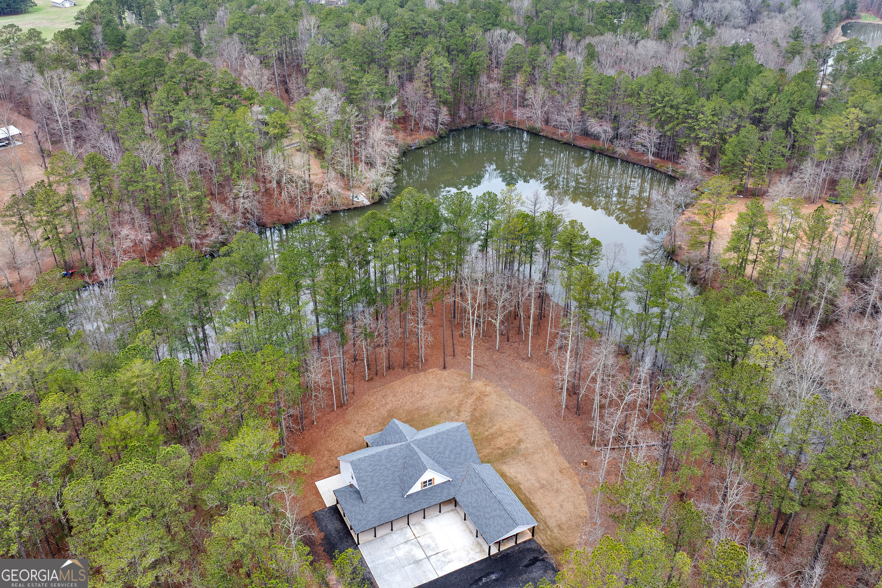 354 Turner Road Newnan, GA 30263 - Photo 69 of 83 an aerial view of a house with a yard lake and trees all around