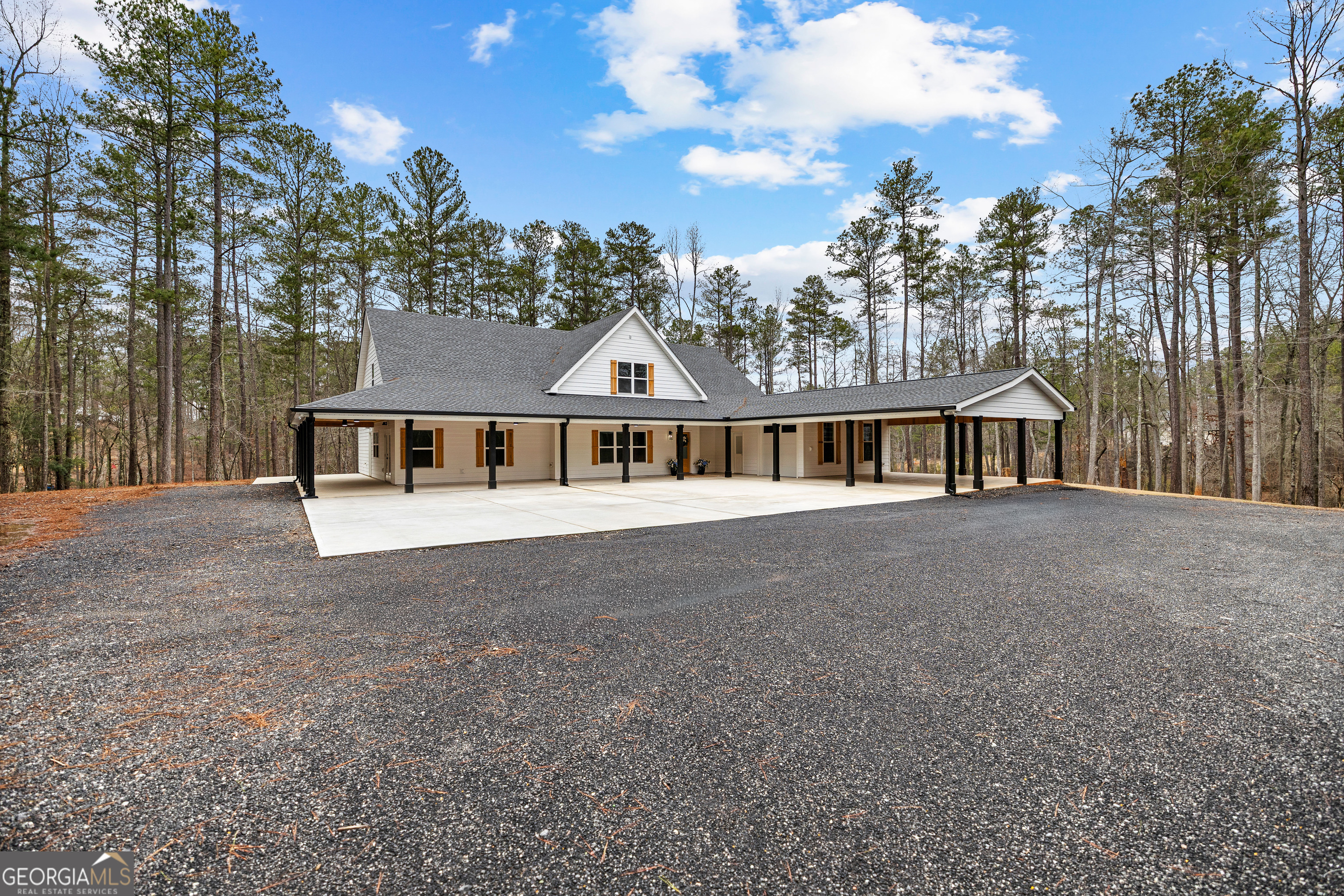 354 Turner Road Newnan, GA 30263 - Photo 7 of 83 a front view of a house with a garden and trees