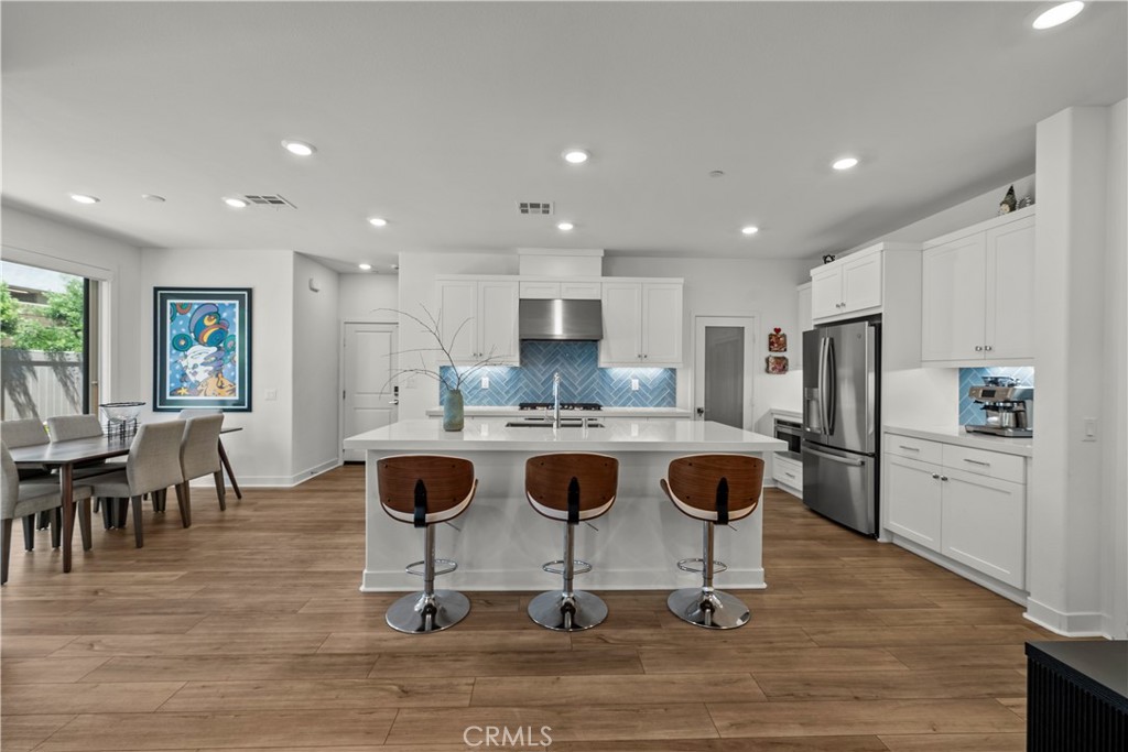 1663 Rosewell Road West Covina, CA 91791 - Photo 9 of 45 a view of kitchen with stainless steel appliances granite countertop dining table and chairs