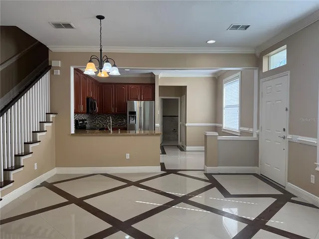 a room with lots of wooden furniture and mirrors