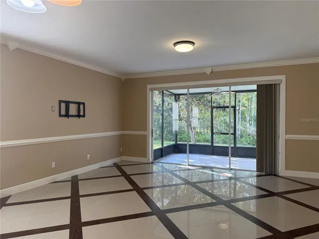 a view of empty room with floor to ceiling window