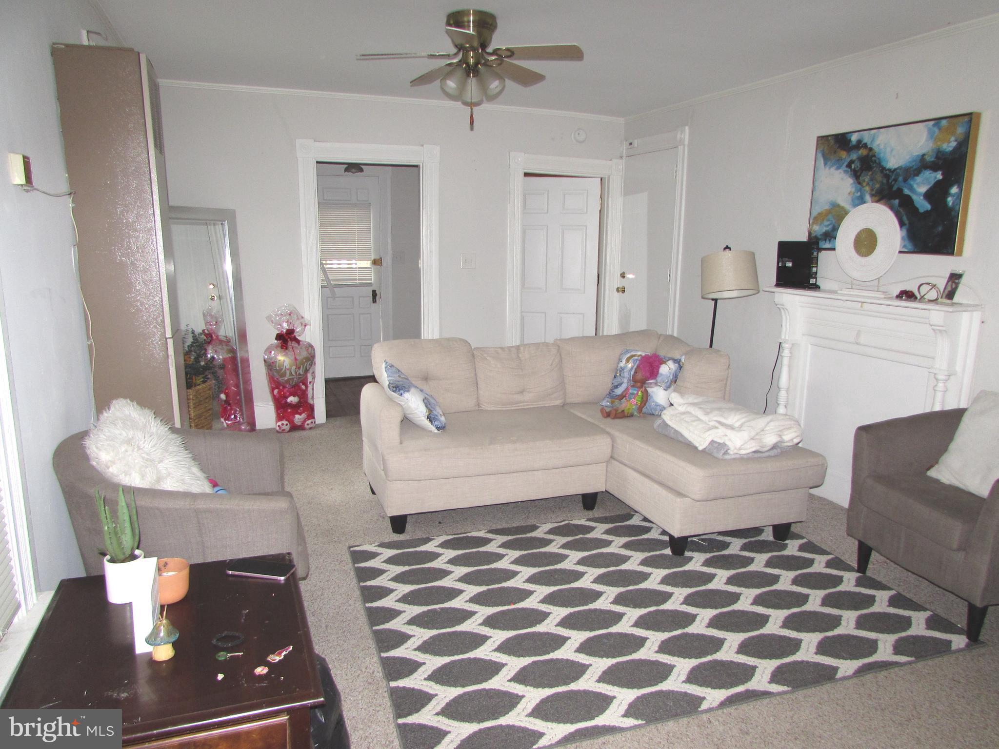 207 Gay Street Denton, MD 21629 - Photo 18 of 25 a living room with furniture and a fireplace