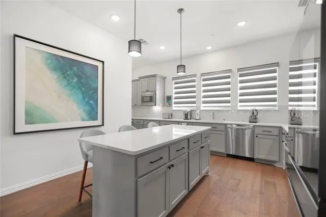 a kitchen with a sink stove and window