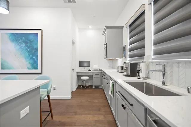 a kitchen with a sink cabinets and counter space