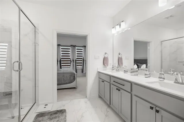 a en suite bathroom with a sink and a mirror