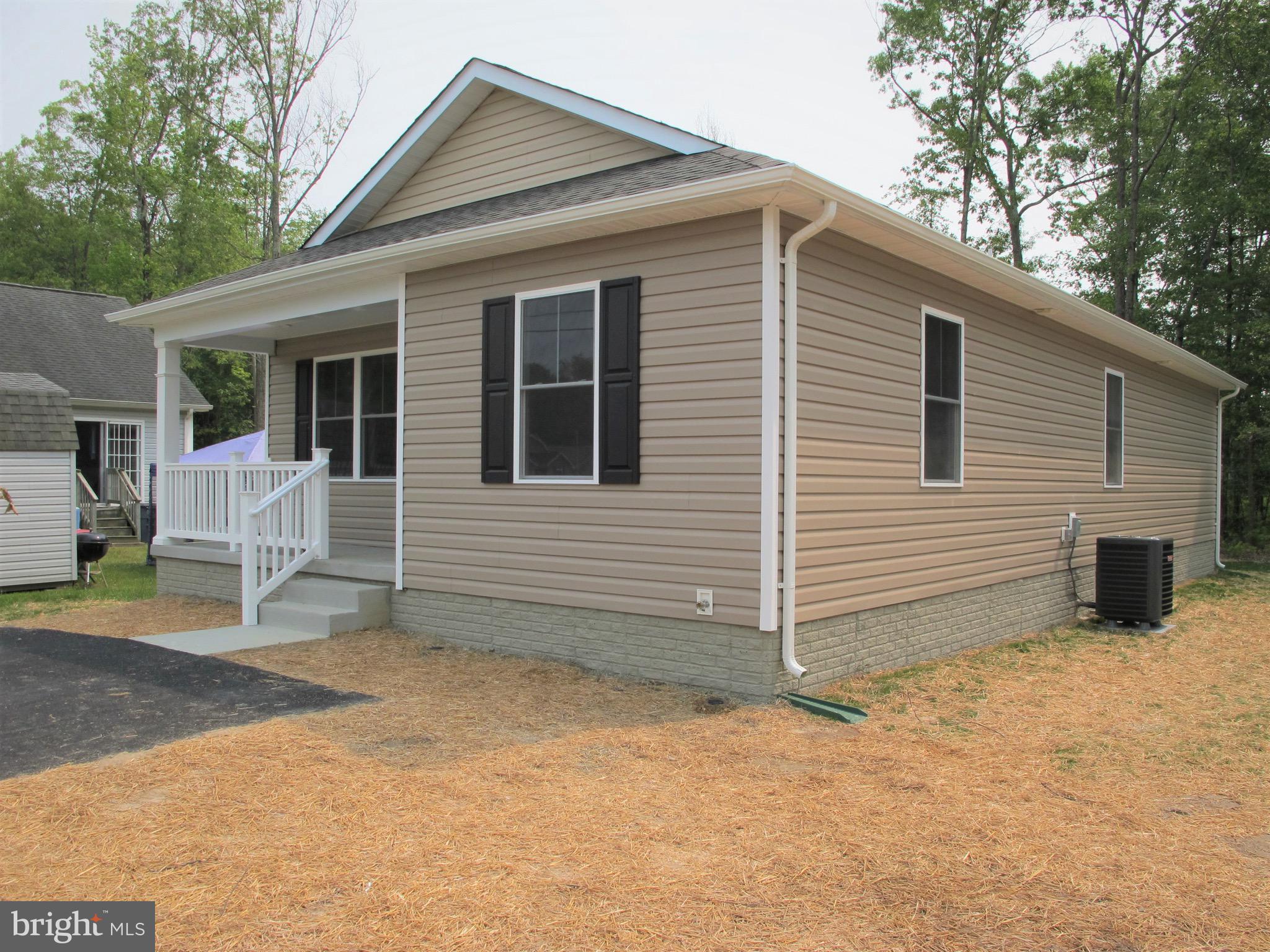 23 A 9th Street Colonial Beach, VA 22443 - Photo 2 of 56 a view of backyard with a large tree