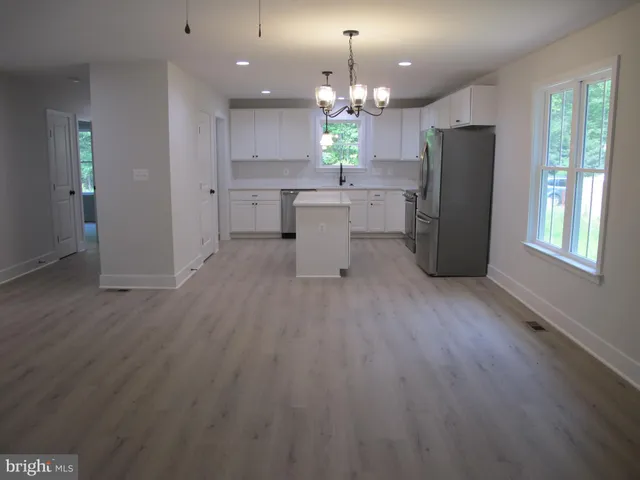 a view of room with hardwood floor