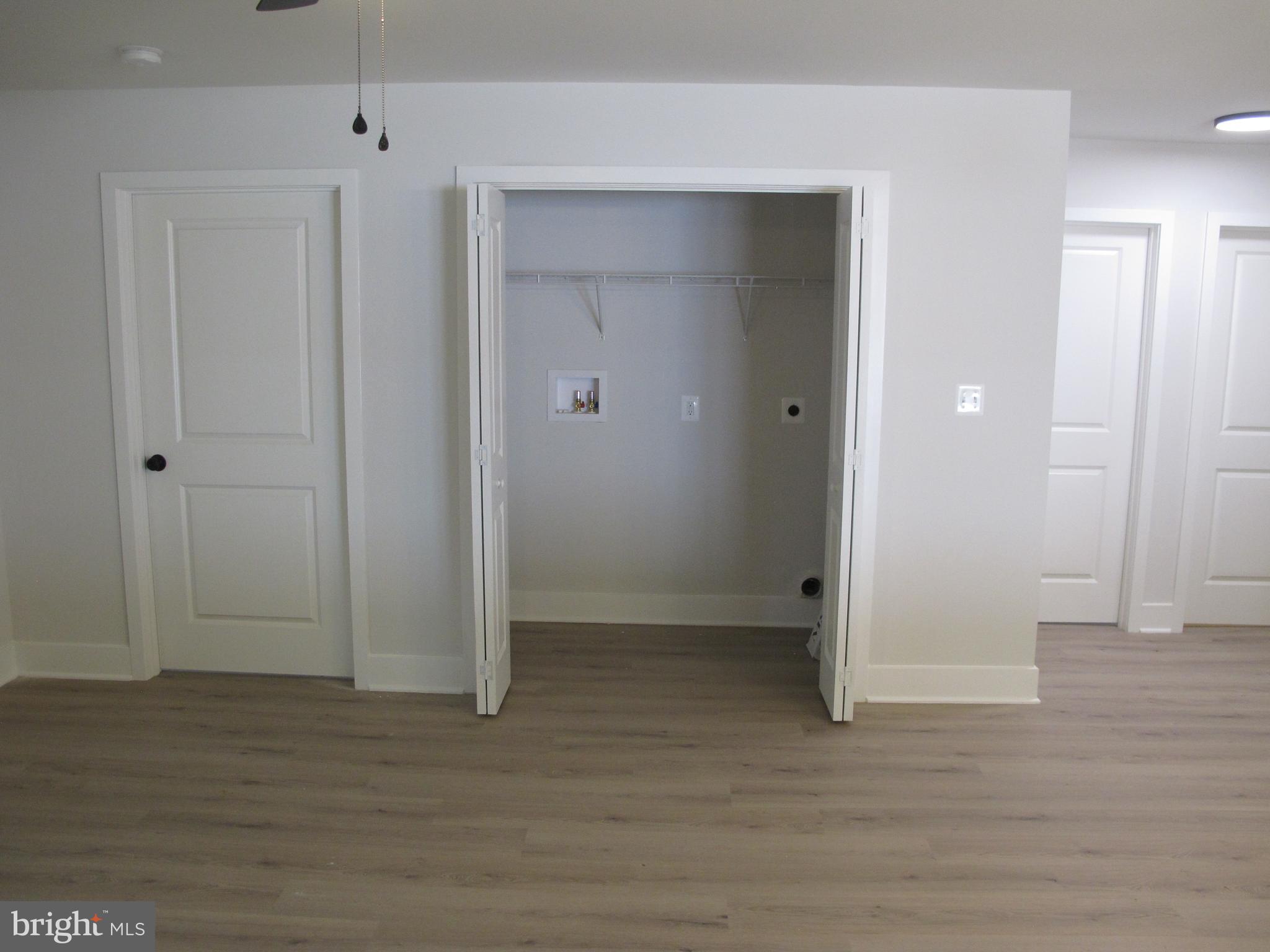 23 A 9th Street Colonial Beach, VA 22443 - Photo 29 of 56 an empty room with wooden floor