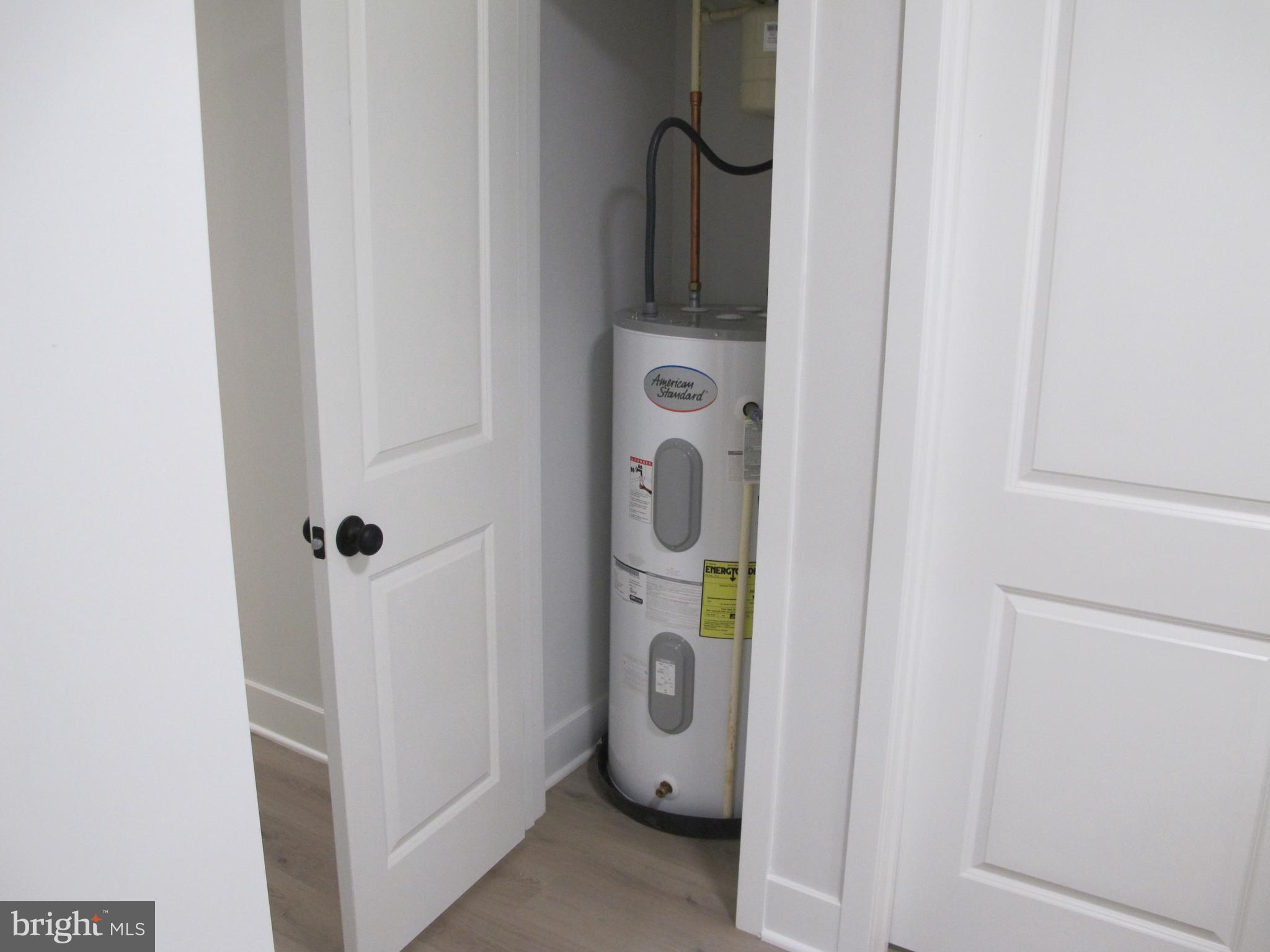 23 A 9th Street Colonial Beach, VA 22443 - Photo 31 of 56 a utility room with refrigerator and washer