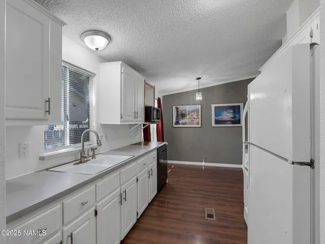 a spacious bathroom with a double vanity sink and a mirror