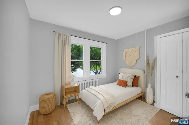 a bedroom with a bed and window