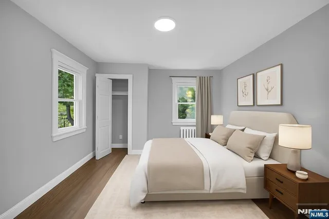 a bedroom with a bed and a lamp