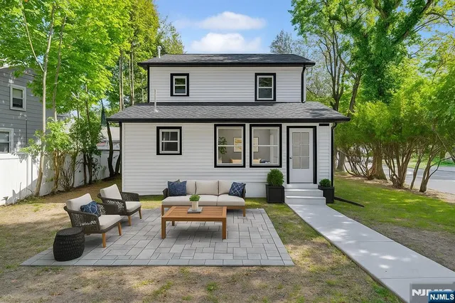 an aerial view of a house with a yard and garden