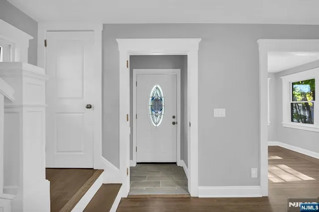 a view of room with window and wooden floor
