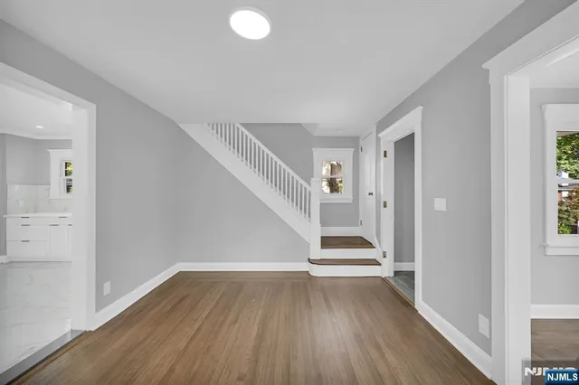 a view of entryway with wooden floor