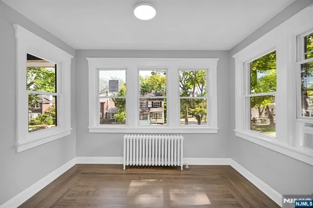 a view of empty room with windows