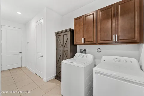 a bathroom with a sink toilet and a mirror