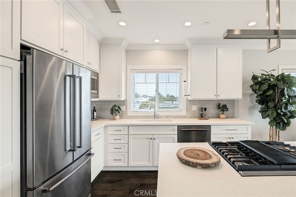 17512 Van Ness Avenue Torrance, CA 90504 - Photo 15 of 41 a kitchen with a refrigerator and a stove