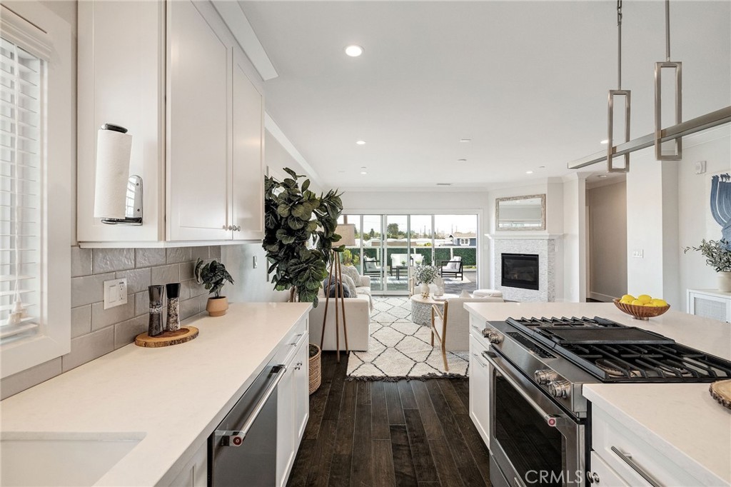 17512 Van Ness Avenue Torrance, CA 90504 - Photo 17 of 41 a kitchen with a stove and white cabinets