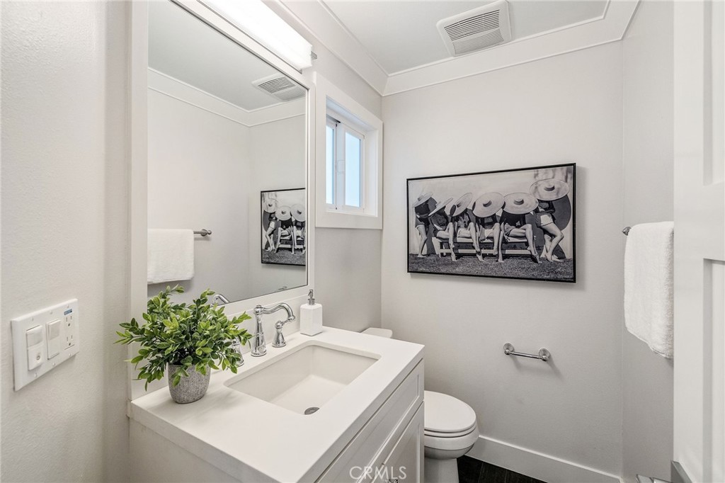 17512 Van Ness Avenue Torrance, CA 90504 - Photo 18 of 41 a bathroom with a sink mirror and toilet