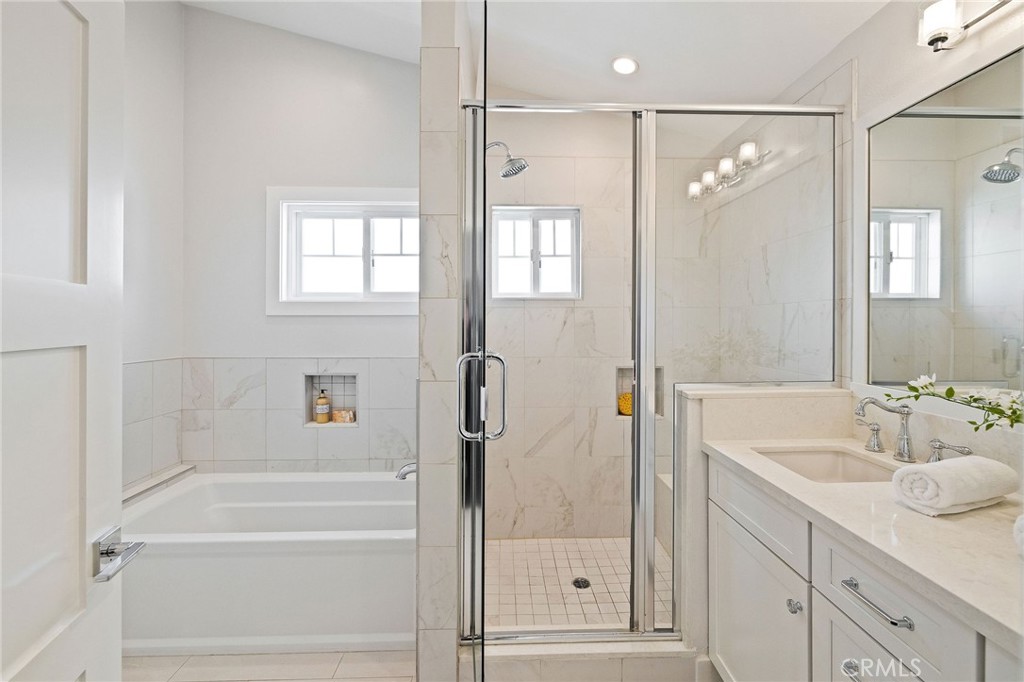 17512 Van Ness Avenue Torrance, CA 90504 - Photo 30 of 41 a bathroom with a shower sink vanity and a mirror