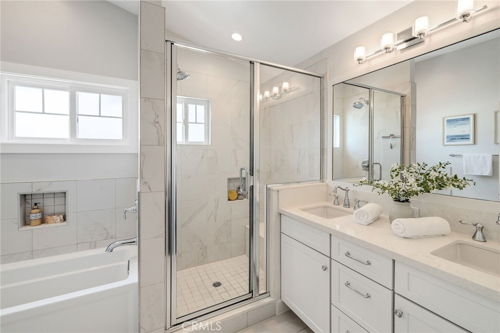 17512 Van Ness Avenue Torrance, CA 90504 - Photo 32 of 41 a bathroom with a tub sink shower and mirror
