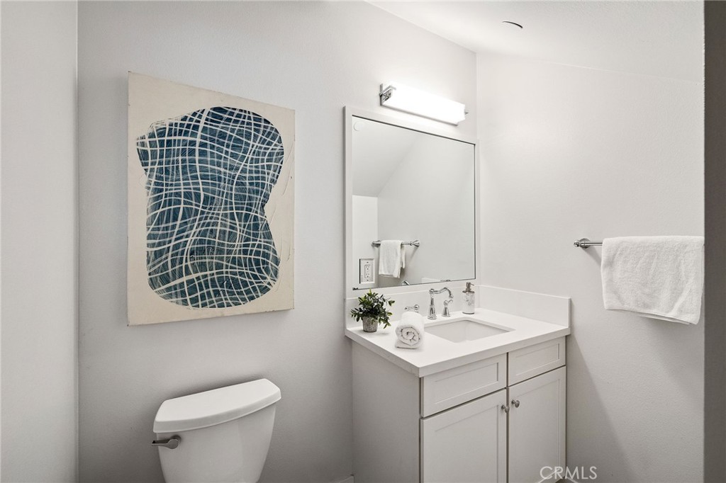 17512 Van Ness Avenue Torrance, CA 90504 - Photo 33 of 41 a bathroom with a sink toilet and mirror