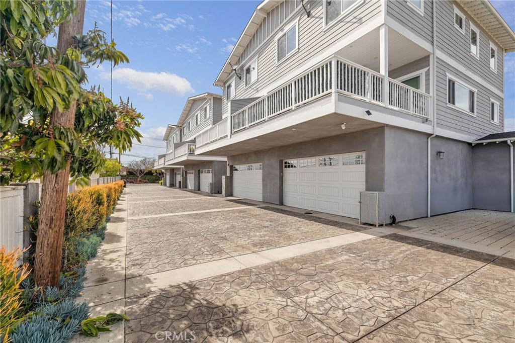 17512 Van Ness Avenue Torrance, CA 90504 - Photo 39 of 41 a front view of a building with a yard and garage