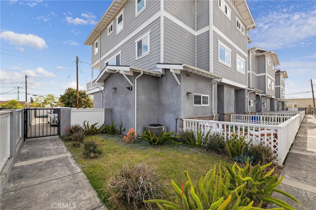 17512 Van Ness Avenue Torrance, CA 90504 - Photo 40 of 41 a view of a brick house with a small yard and plants
