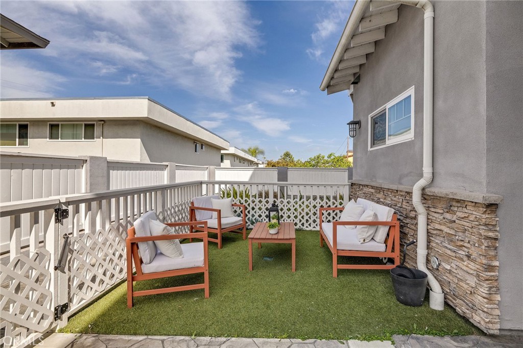 17512 Van Ness Avenue Torrance, CA 90504 - Photo 6 of 41 a balcony with wooden benches and bench