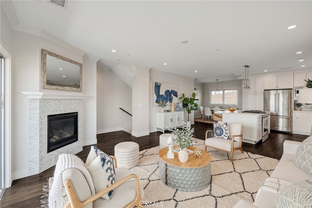 17512 Van Ness Avenue Torrance, CA 90504 - Photo 9 of 41 a living room with furniture a fireplace and a table