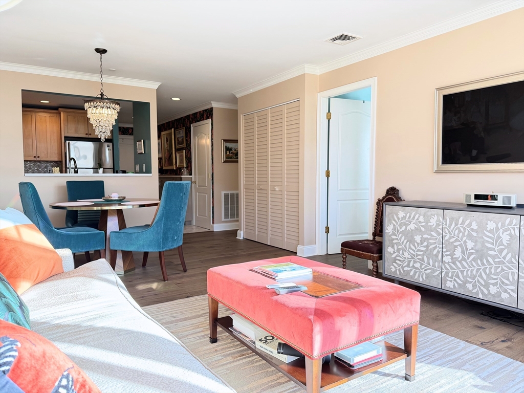 a bedroom with furniture and a flat screen tv