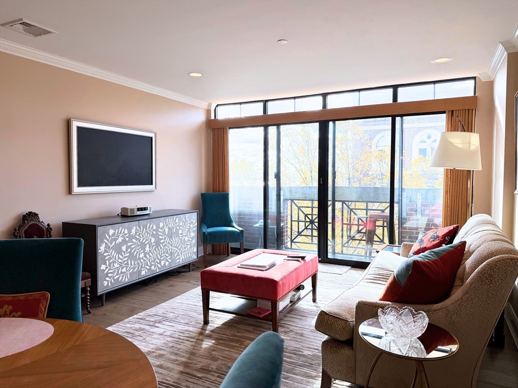 540 East Broadway, Unit 5A Boston, MA 02127 - Photo 14 of 17 a living room with furniture and a flat screen tv