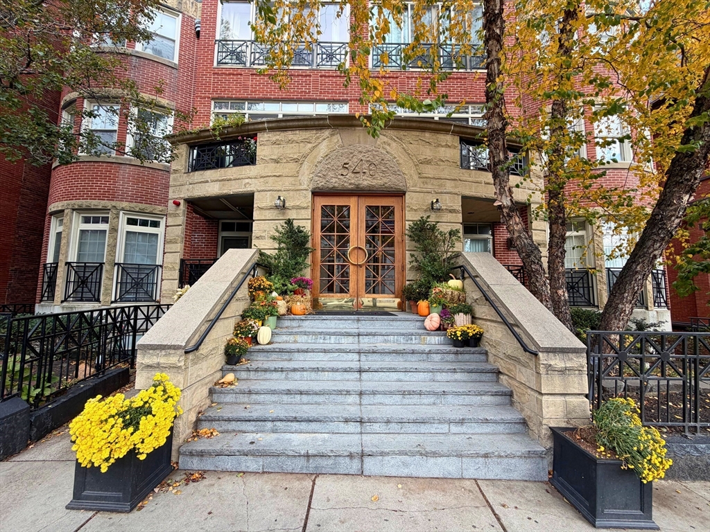 540 East Broadway, Unit 5A Boston, MA 02127 - Photo 15 of 17 a view of a building with wooden stairs and a bench